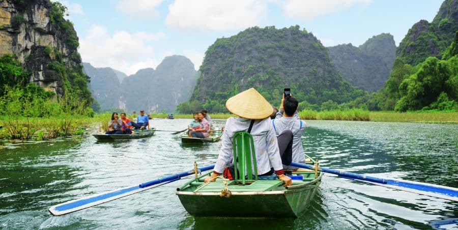 Experience boat ride along Tam Coc
